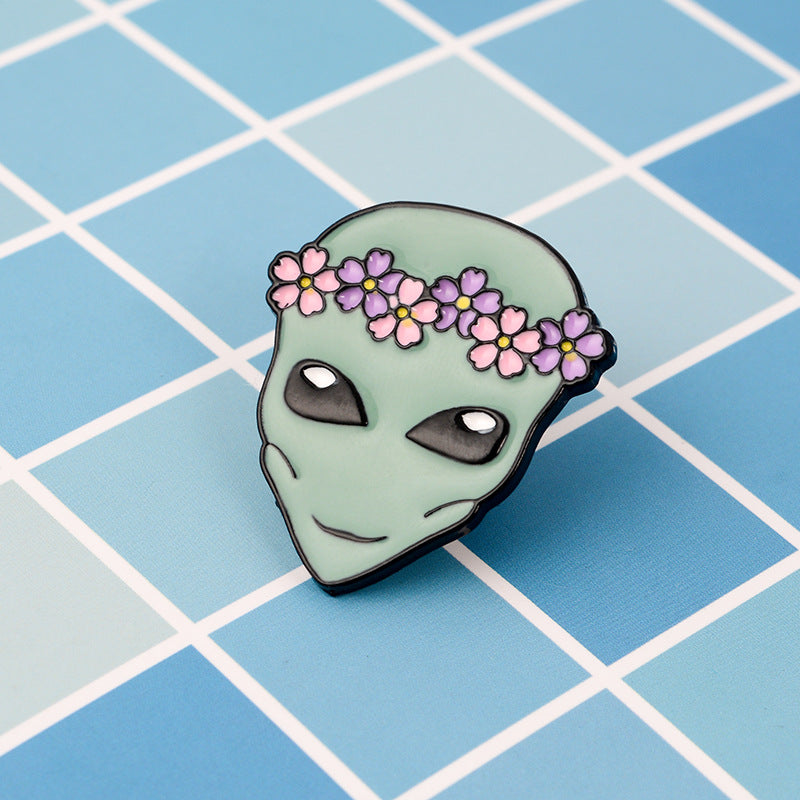 Alien pin with a wreath