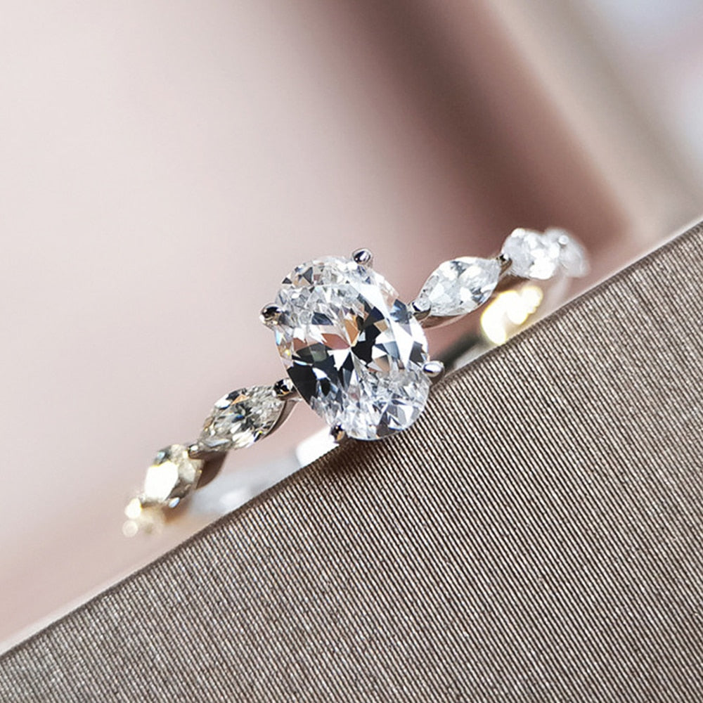 Ring with zircons and a large eyelet