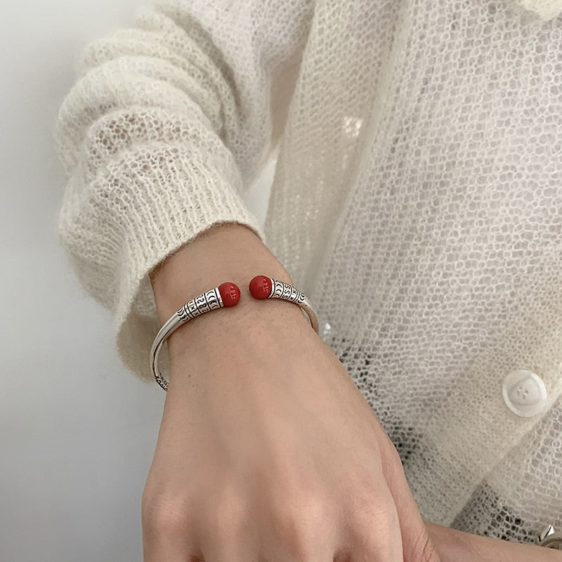 Silver bracelet with decorations