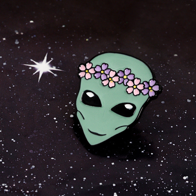 Alien pin with a wreath