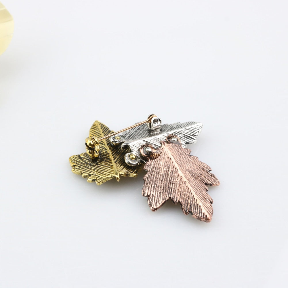 Pin with a leaf motif
