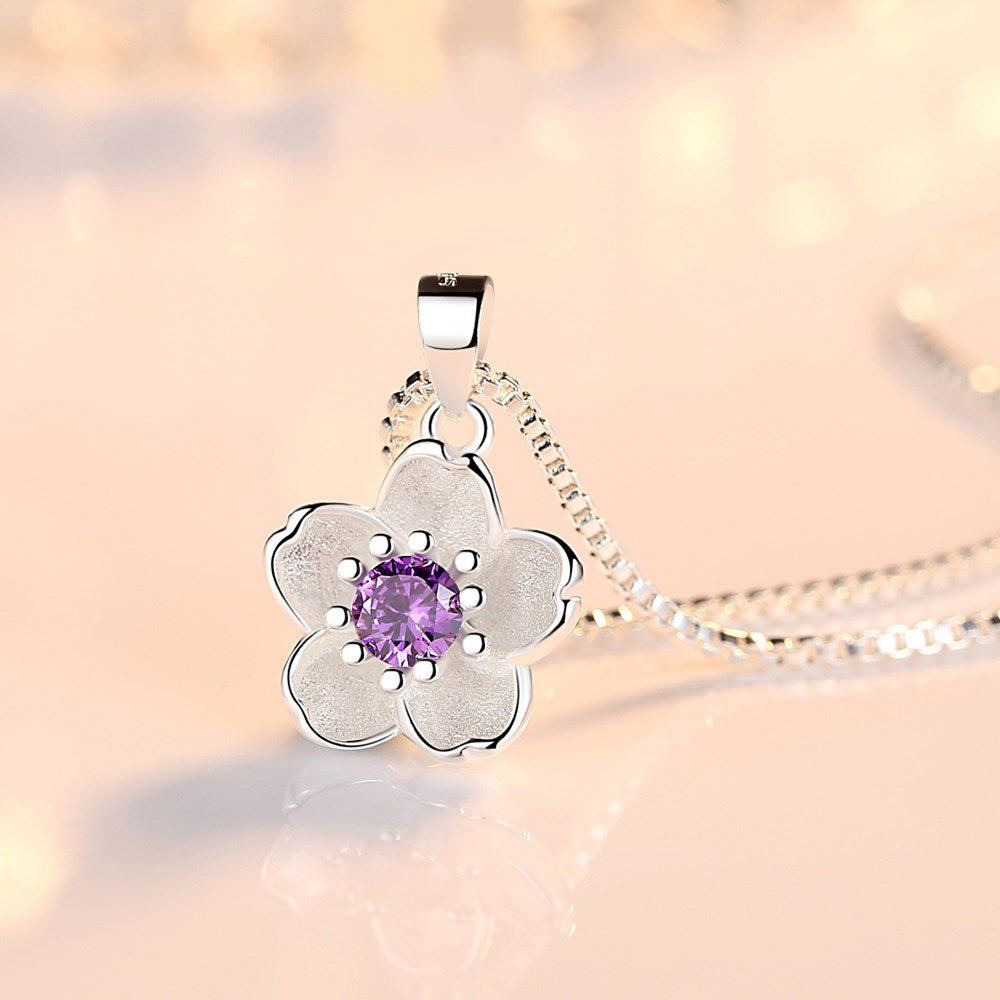 Silver necklace with a flower pendant