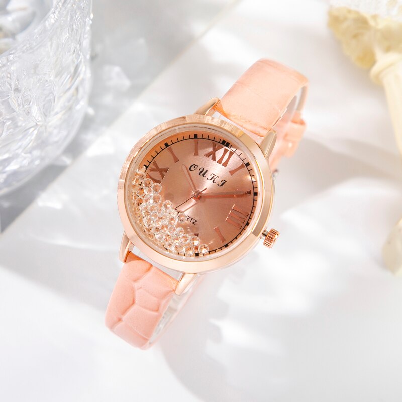 Women's watch with decorative crystals on the dial