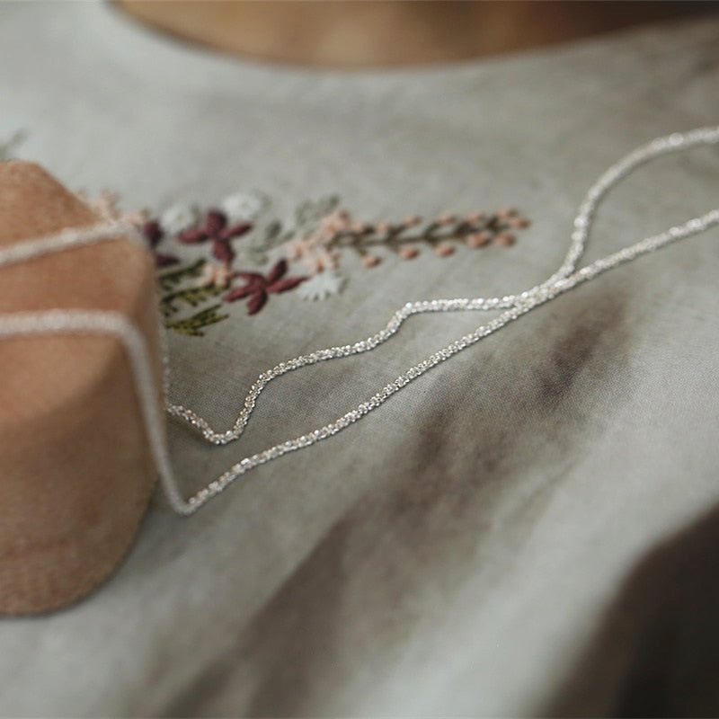 Minimalistic necklace with an eyelet