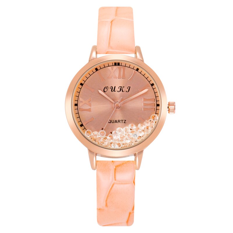 Women's watch with decorative crystals on the dial