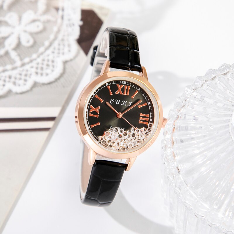 Women's watch with decorative crystals on the dial