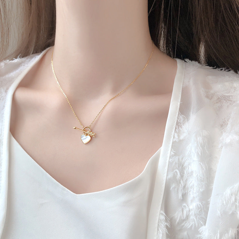 Necklace with a pendant in the form of a heart and arrow