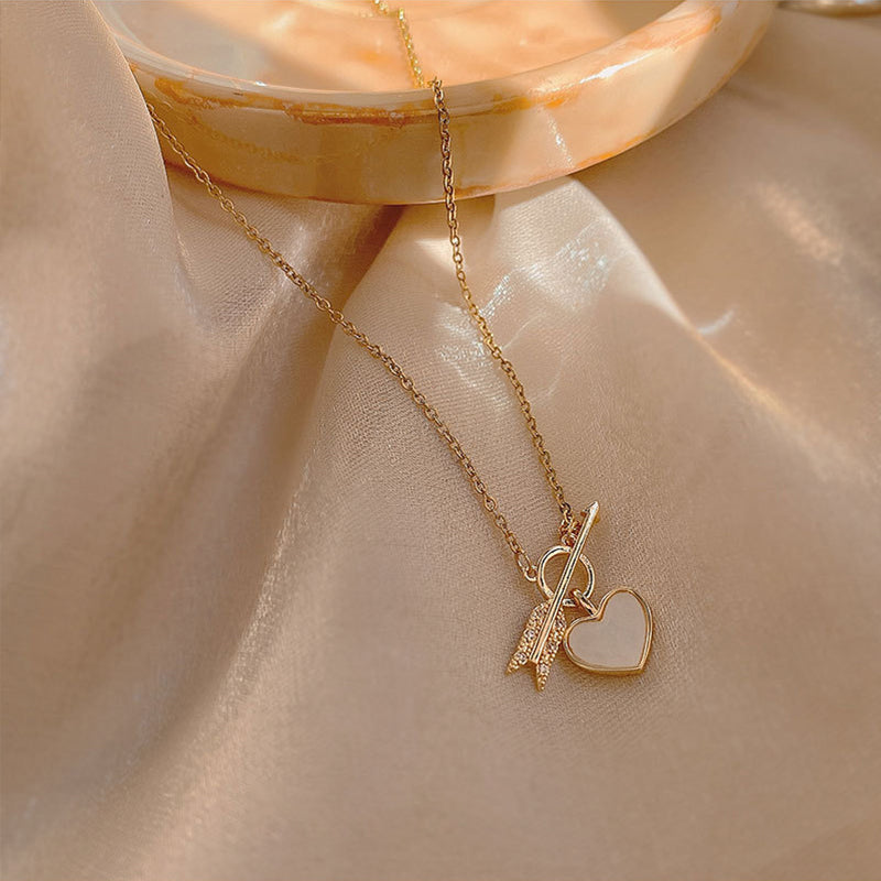 Necklace with a pendant in the form of a heart and arrow