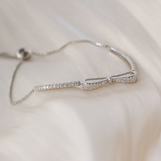 Silver bracelet with a bow