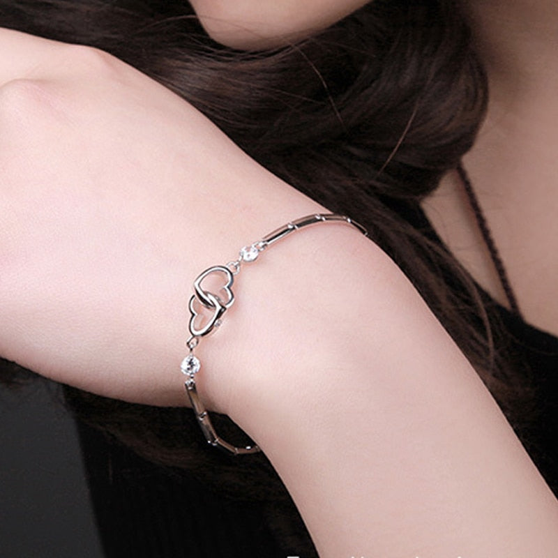 Silver bracelet with hearts