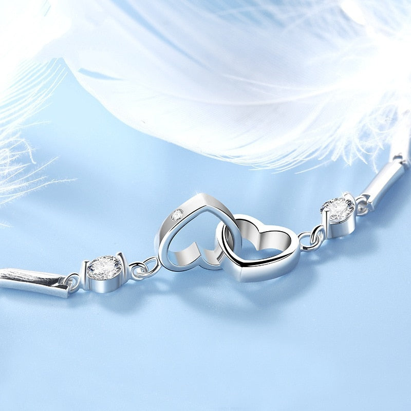 Silver bracelet with hearts