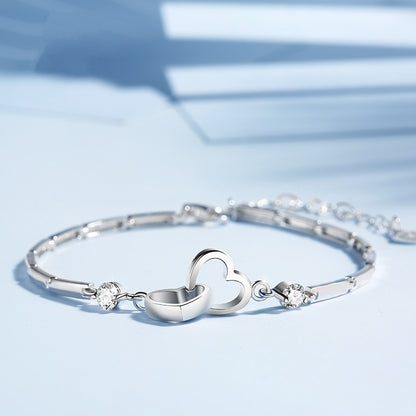 Silver bracelet with hearts