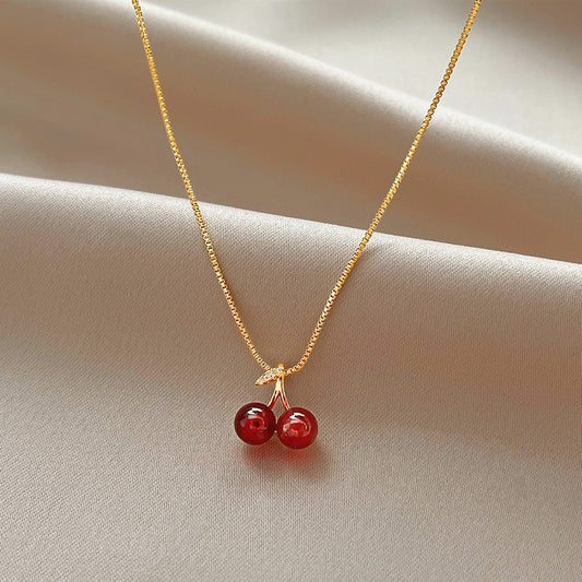 Necklace with a pendant in the shape of a cherry