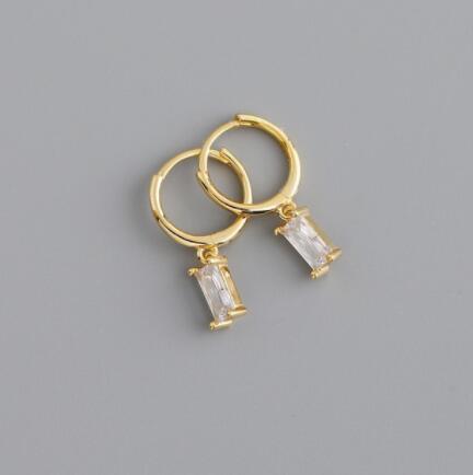 Round earrings with dangling cubic zirconia