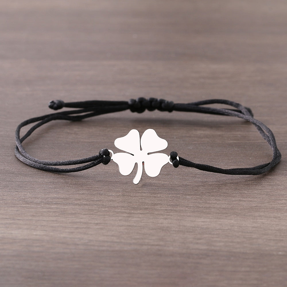 A bracelet on a thong with a four-leaf clover