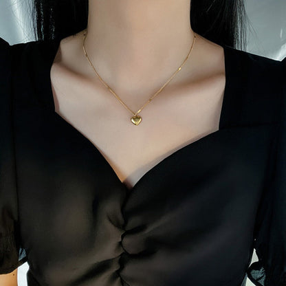 Gold necklace with a heart-shaped pendant