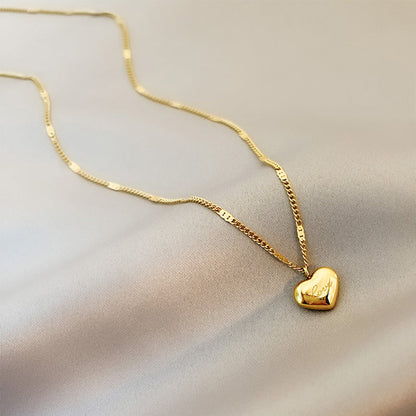 Gold necklace with a heart-shaped pendant