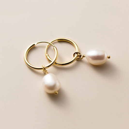 Earrings with pearl pendants