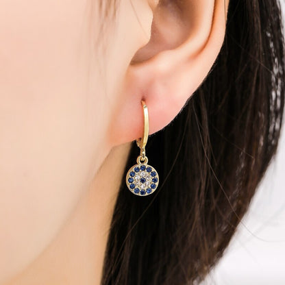 Earrings with blue zircons