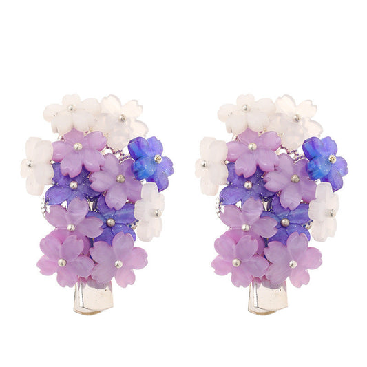 Hair clips with purple flowers