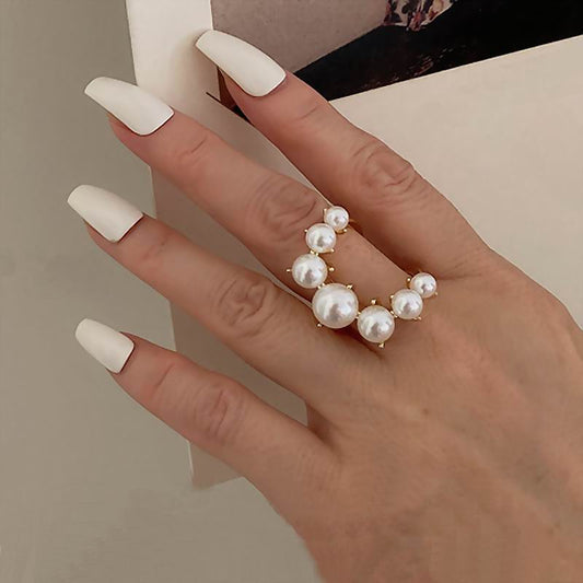 Ring with imitation pearls