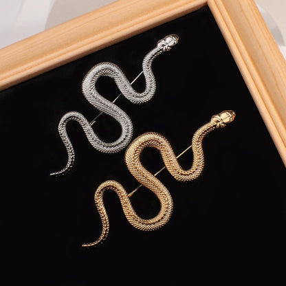 Snake motif brooch