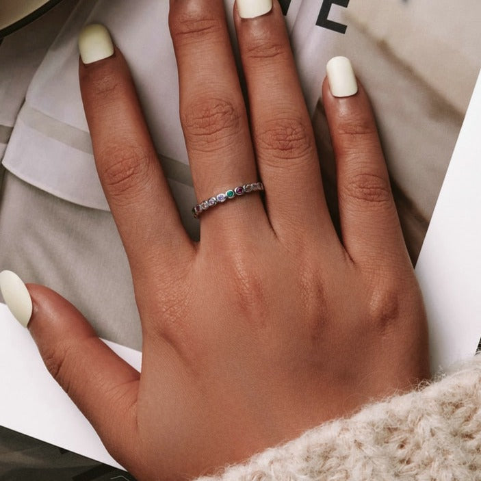 Ring with colorful zircons