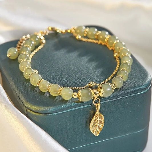 Bead bracelet with a leaf