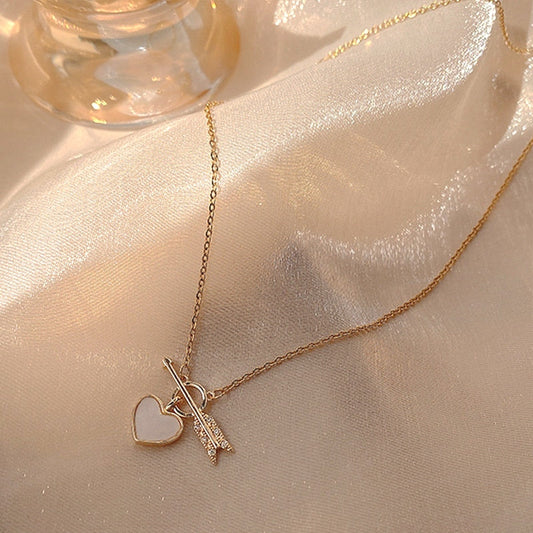 Necklace with a pendant in the form of a heart and arrow