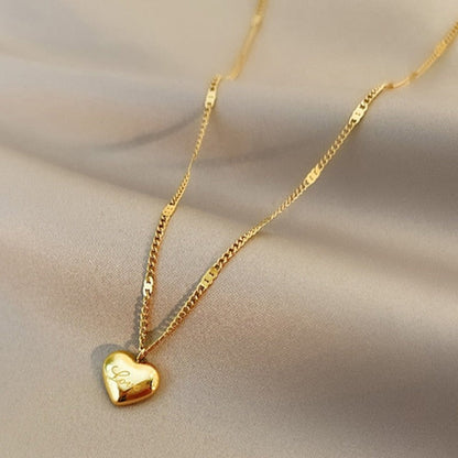 Gold necklace with a heart-shaped pendant